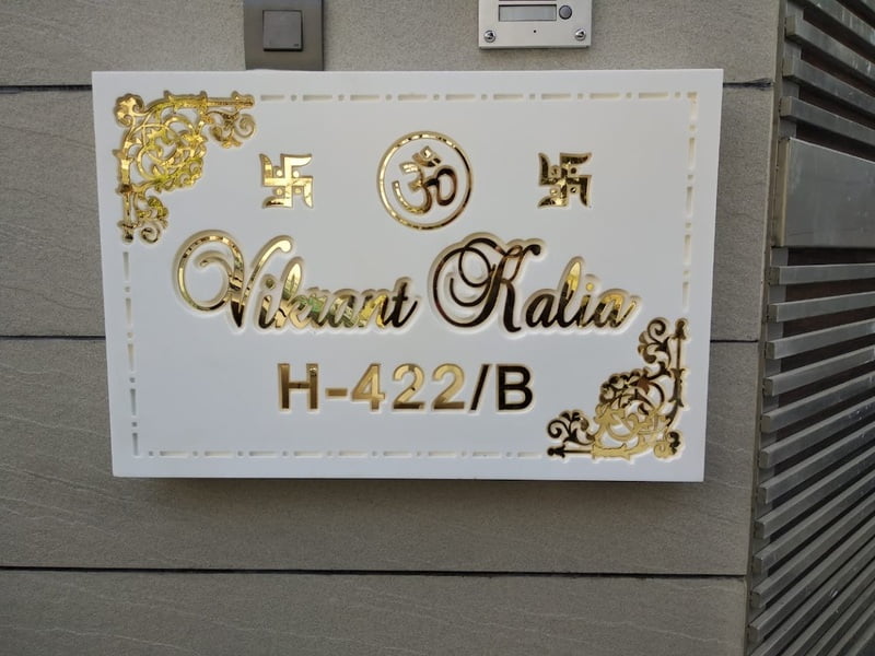 Elegant Corian Nameplate with Golden Accents Elegant Corian Nameplate with Golden Accents