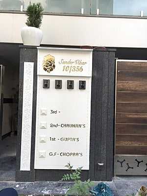 Majestic Corian Nameplate with Golden Accents